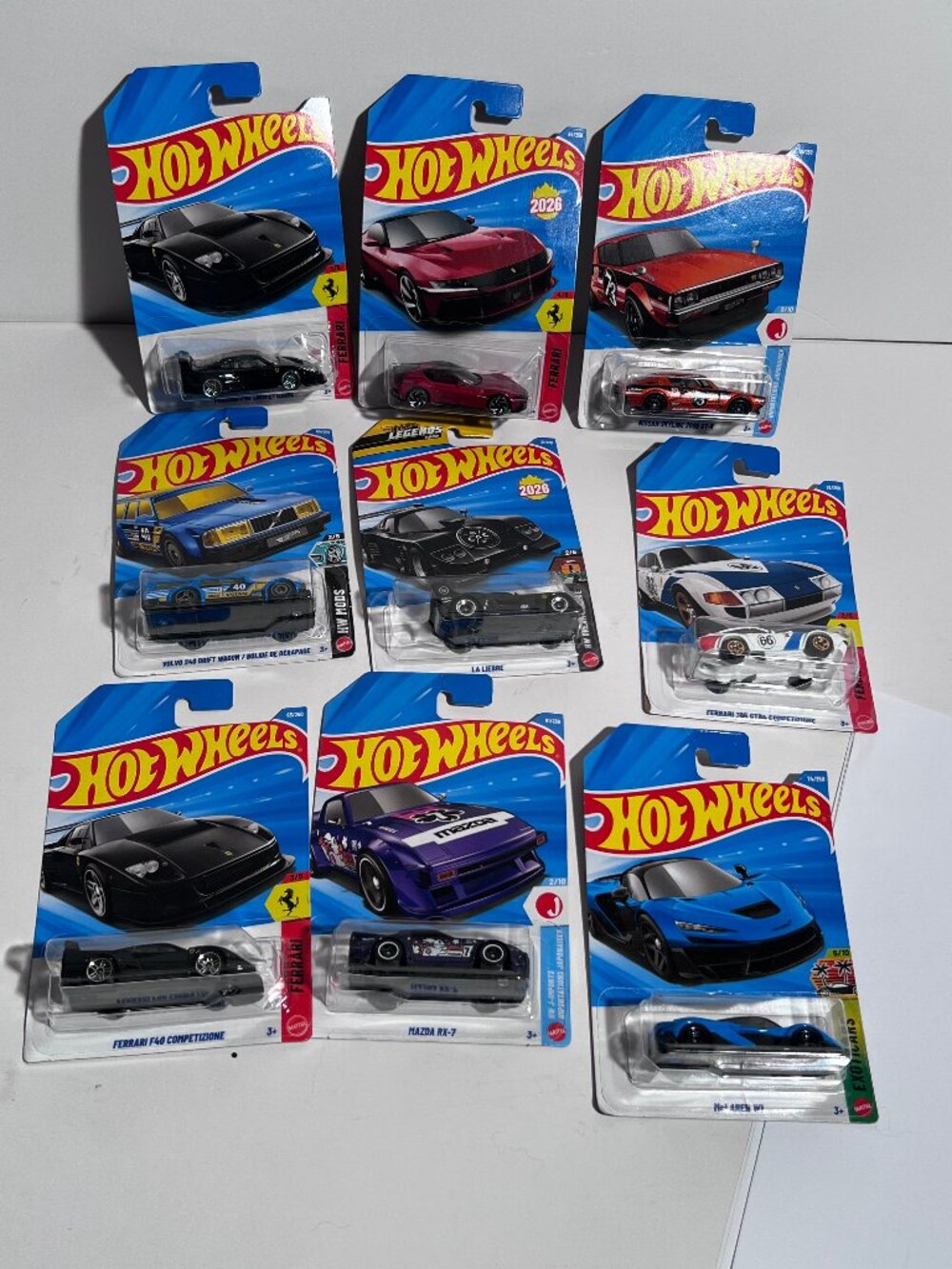 Hot Wheels Diecast Cars Lot of 9 – Ferrari, Mazda, Volvo, Mustang – New Sealed